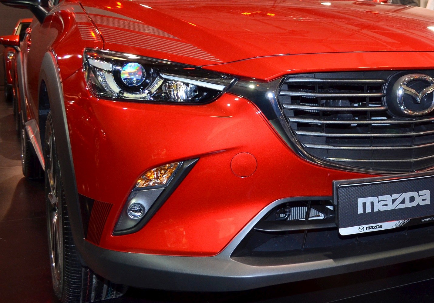 Close-up of front headlight and grille with bumper details