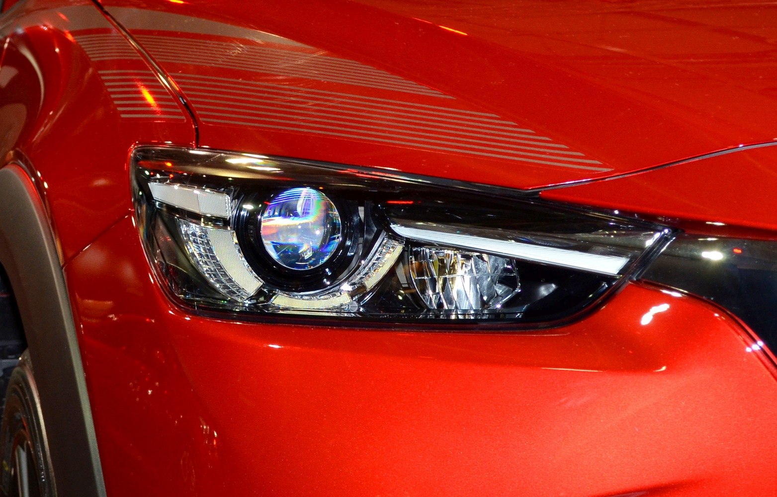 Close-up of Mazda CX-3 headlight with projector and LED elements