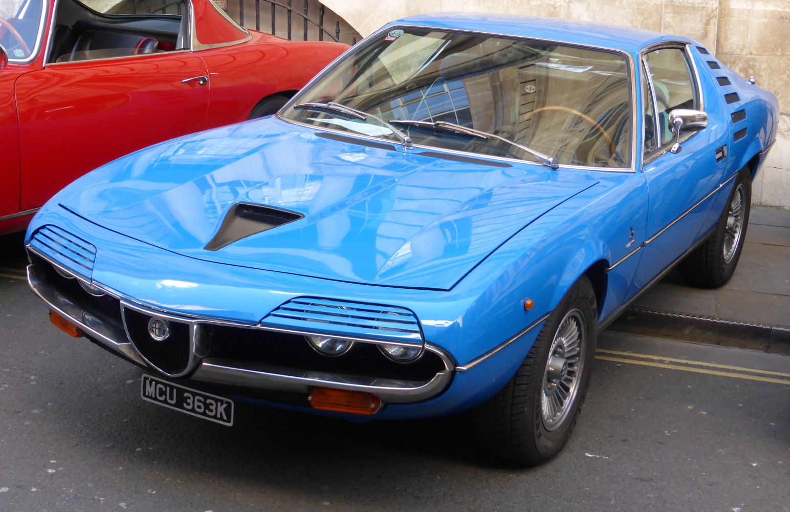 Front grille with unique headlight covers and pronounced hood scoop