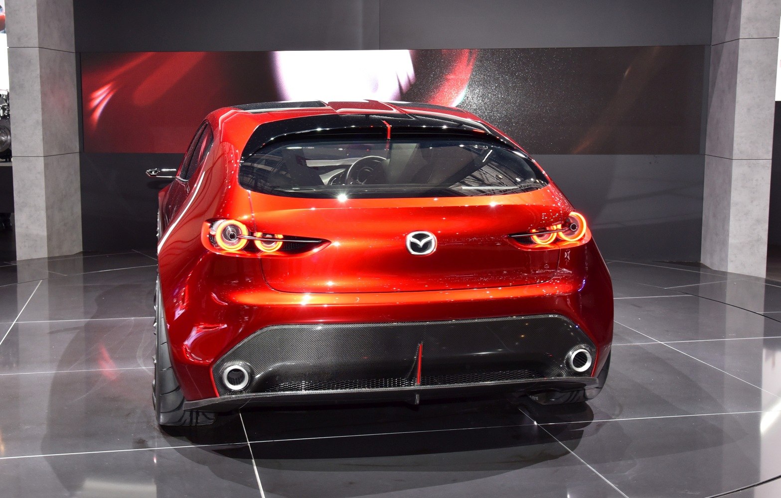 Distinctive rear design with dual circular LED tail lights and sporty diffuser.