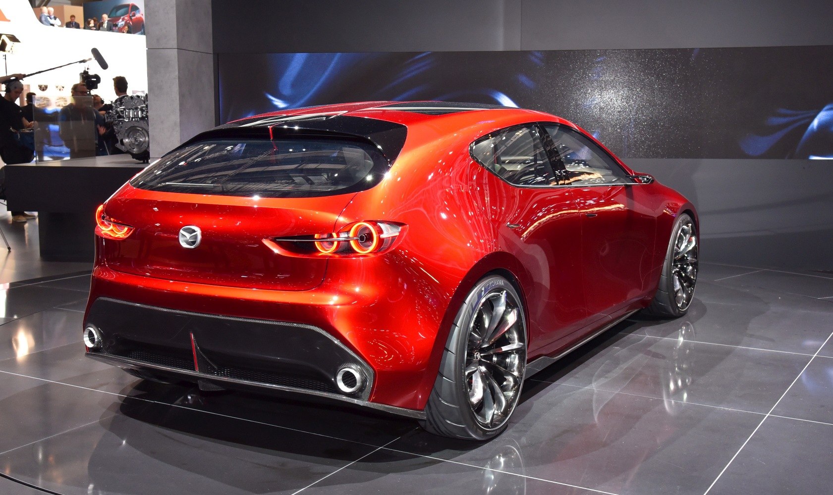 Sleek rear hatchback design with sporty alloy wheels and distinctive taillights