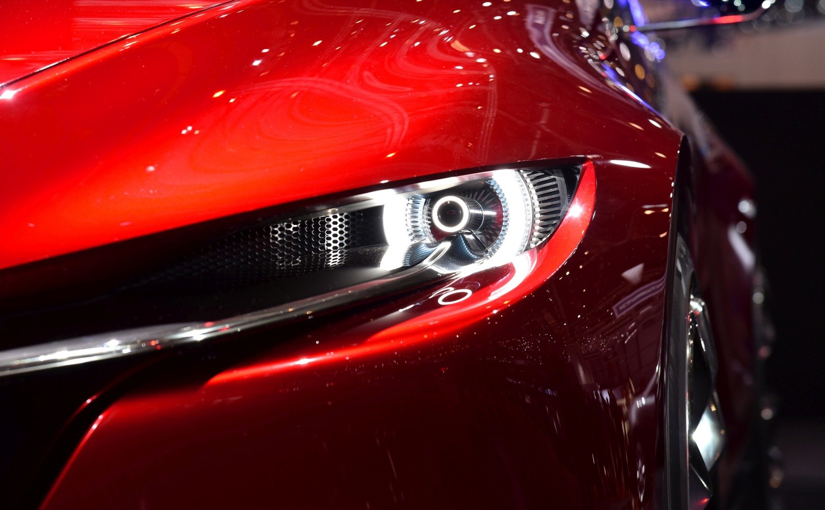 Close-up of sleek front headlight and aerodynamic body lines