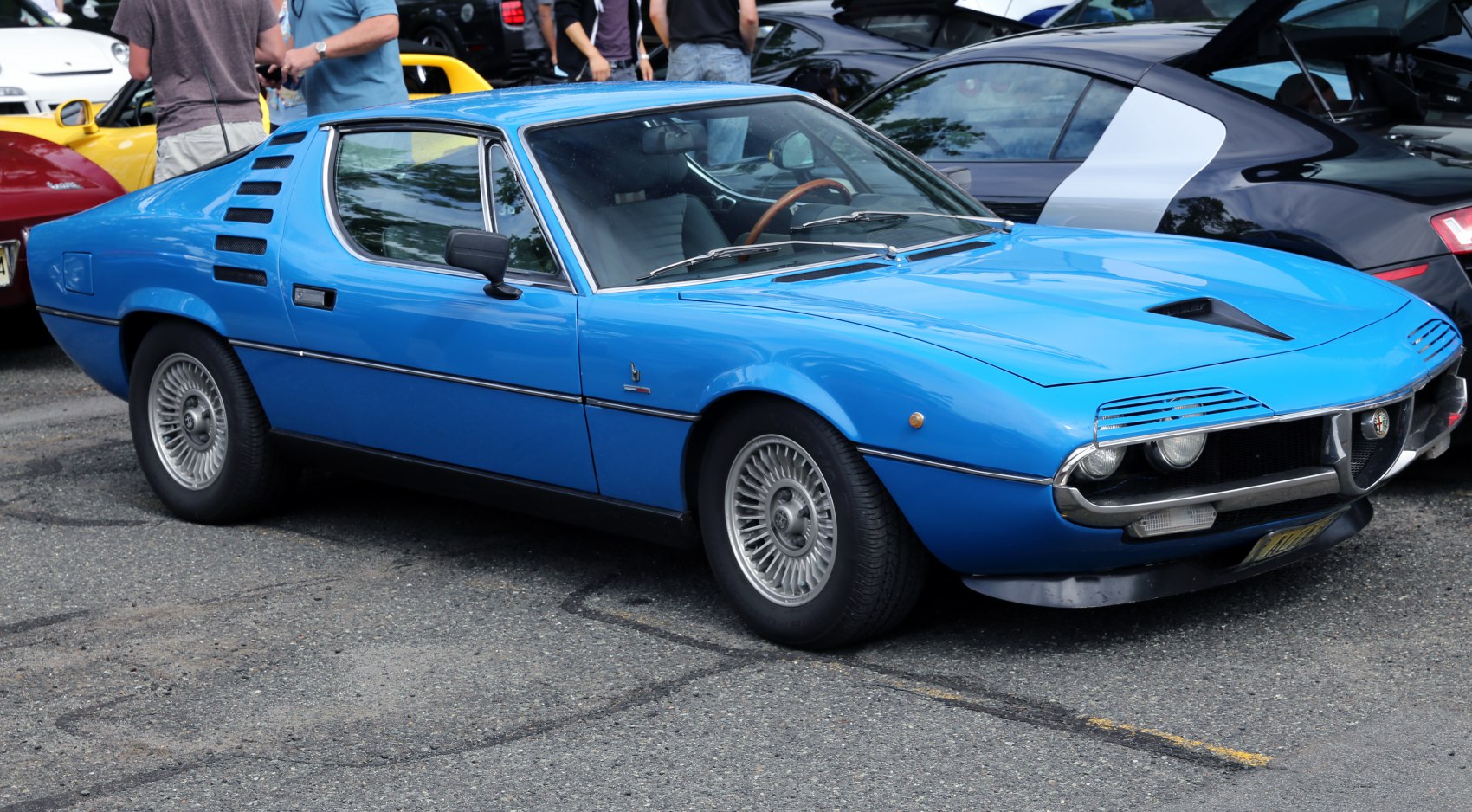 Blue classic coupe with ventilation slats and iconic front grille