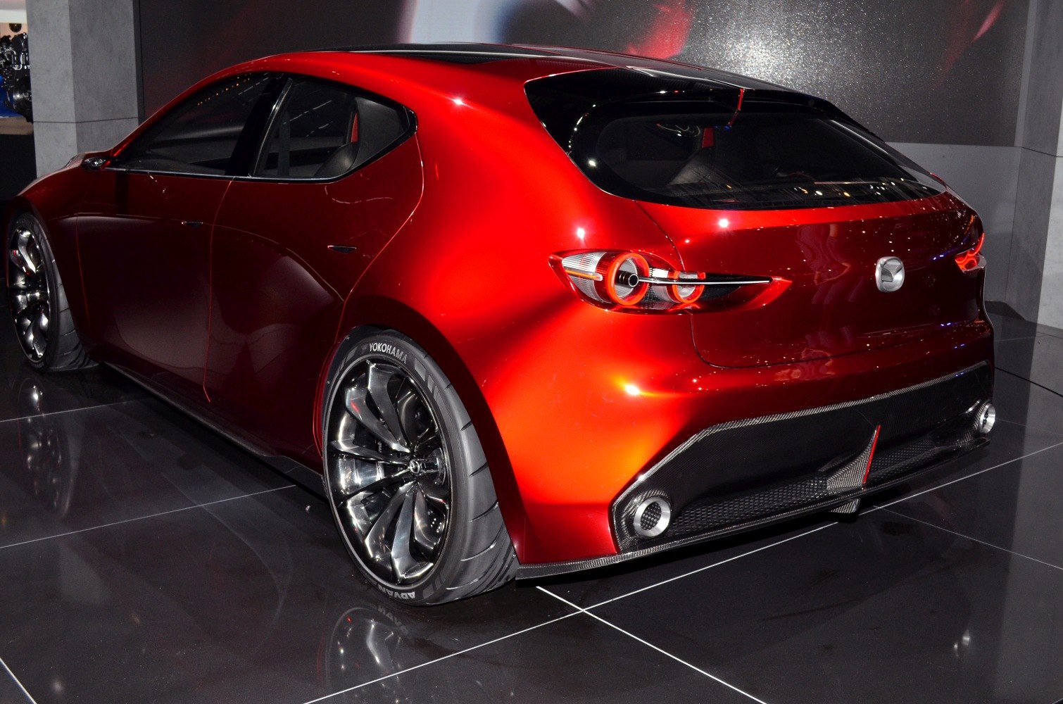 Rear hatch and distinctive tail lights with sporty wheels in red