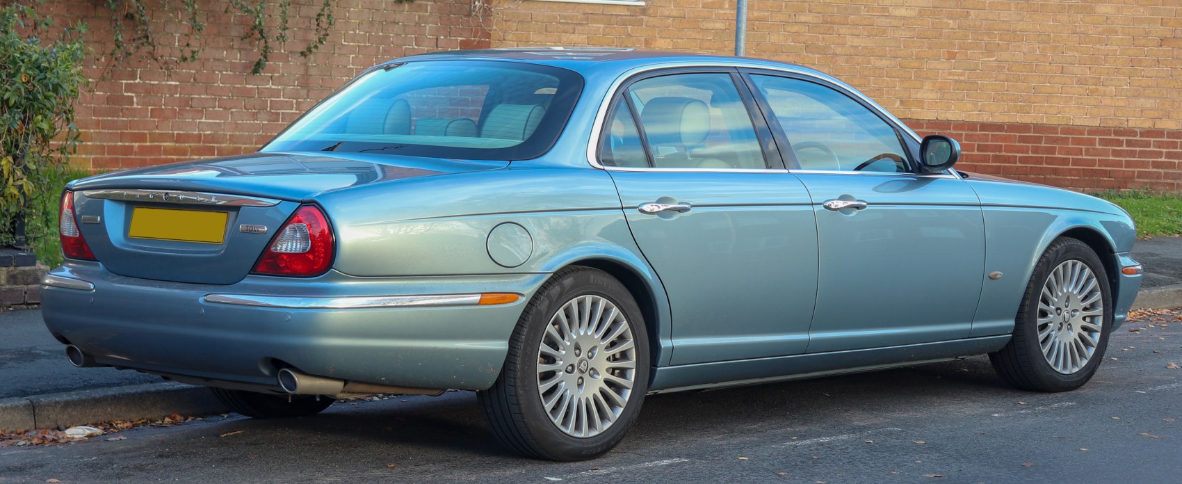 Rear side view with dual exhaust and chrome trim