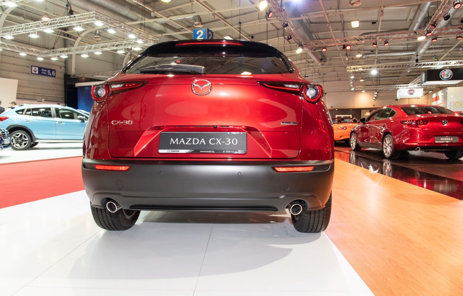 Rear view of a red SUV with dual exhausts and distinctive taillights