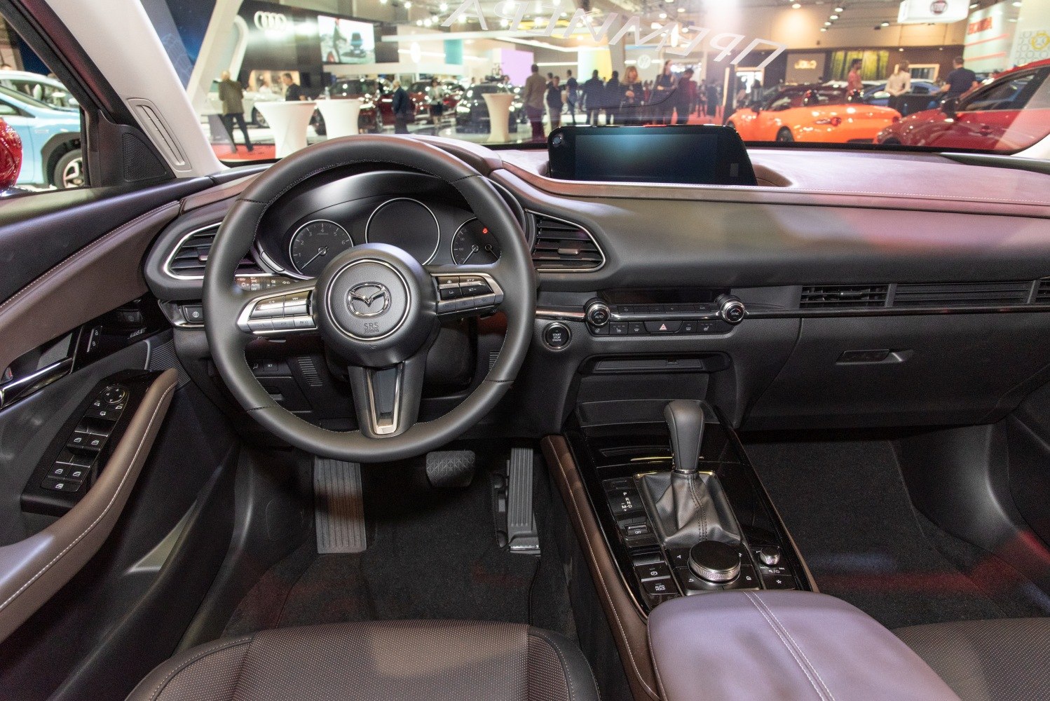 Interior dashboard and steering wheel with infotainment screen and gear shift