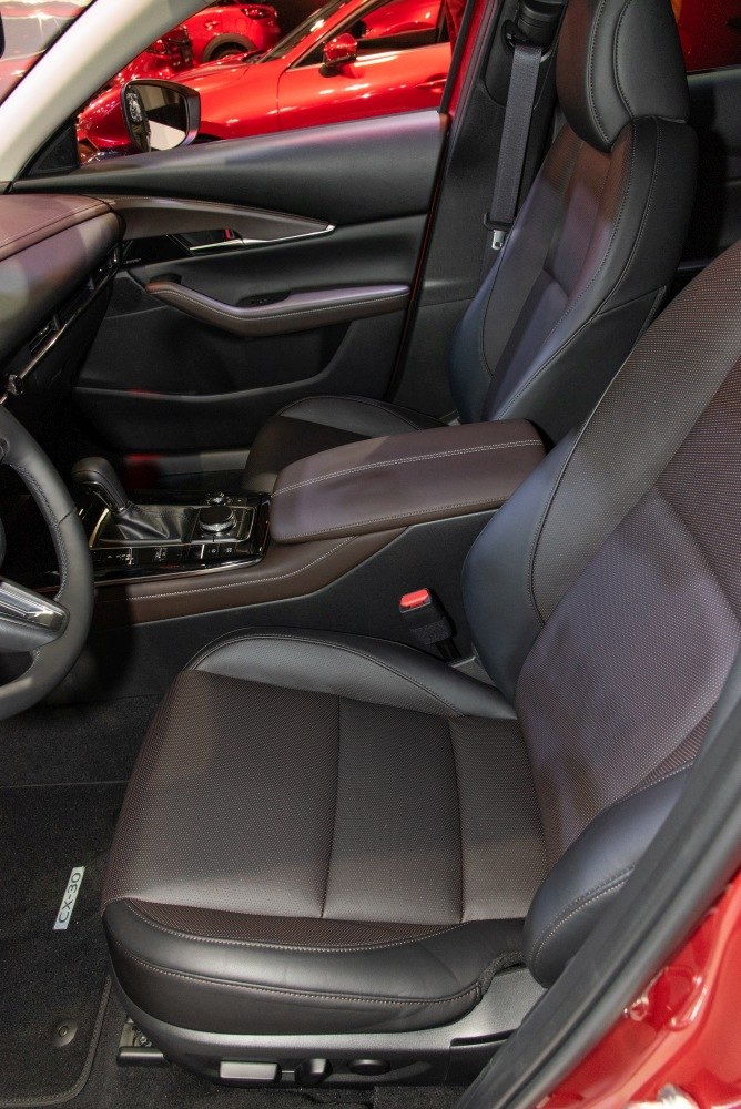 Premium leather front seats with ergonomic design and advanced controls