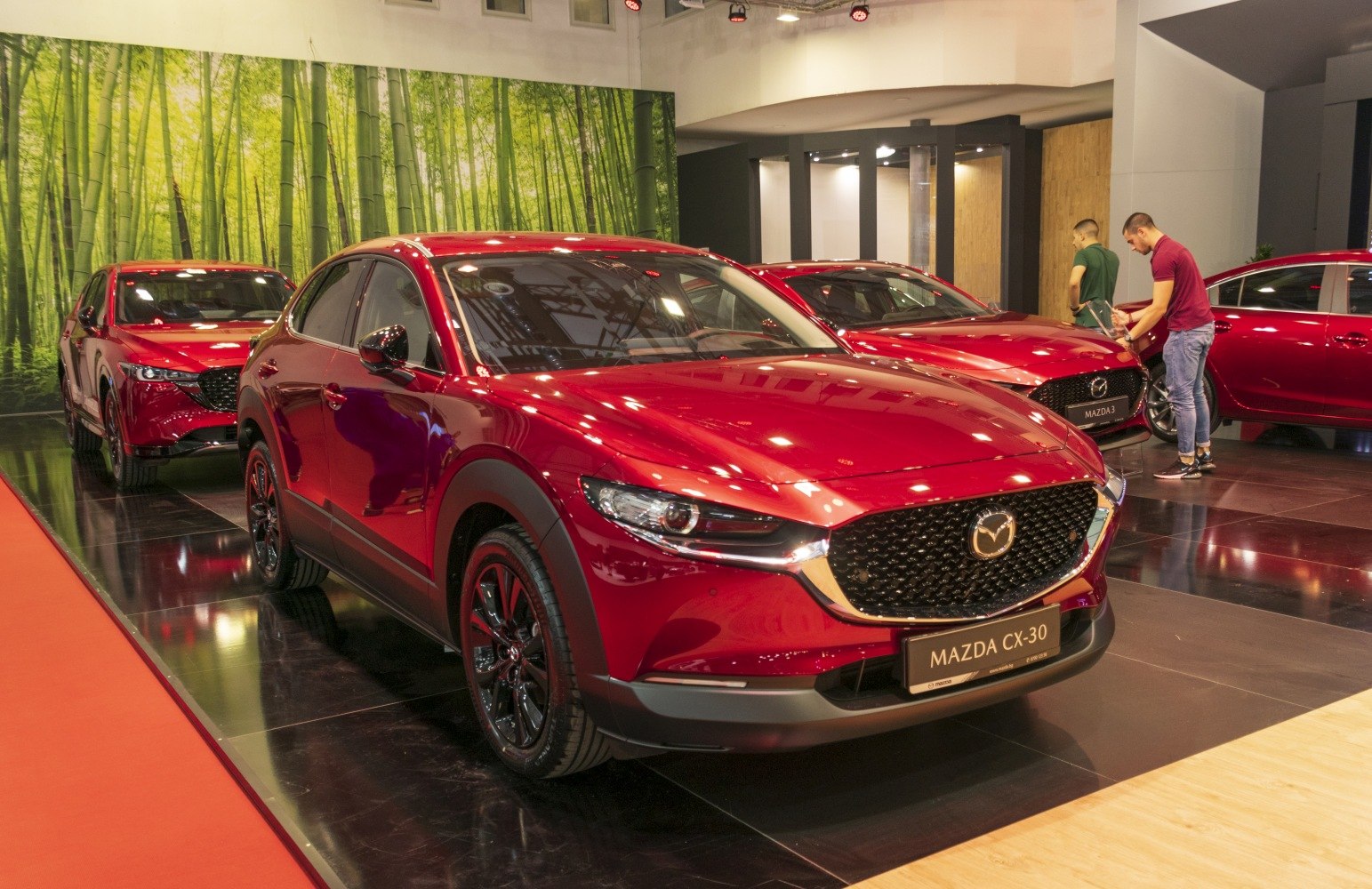 Close-up of Mazda CX-30 front with LED headlights and black grille