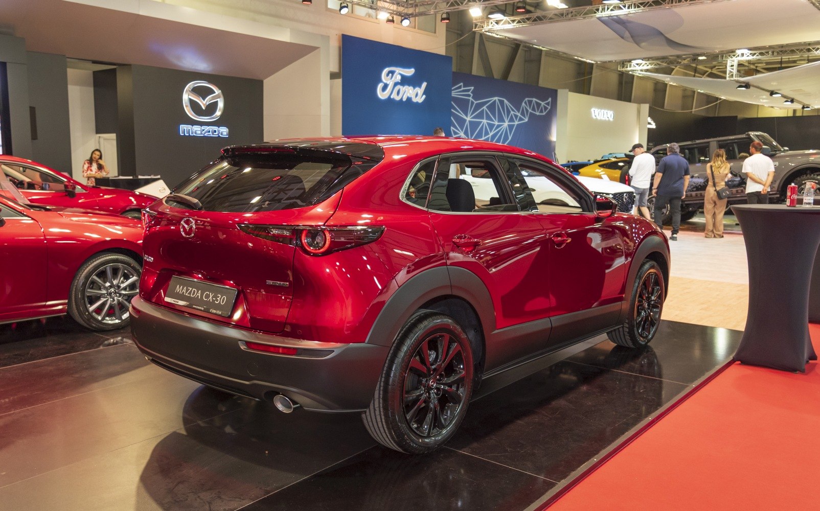 Red Mazda CX-30 rear with black alloy wheels