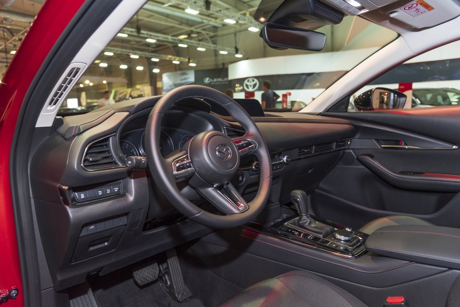 Dashboard, steering wheel, gearshift, and control panel of a car interior