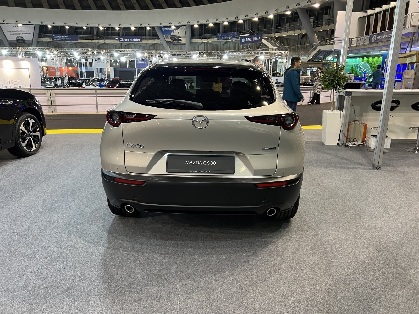Rear view with tail lights, rear window, and dual exhausts