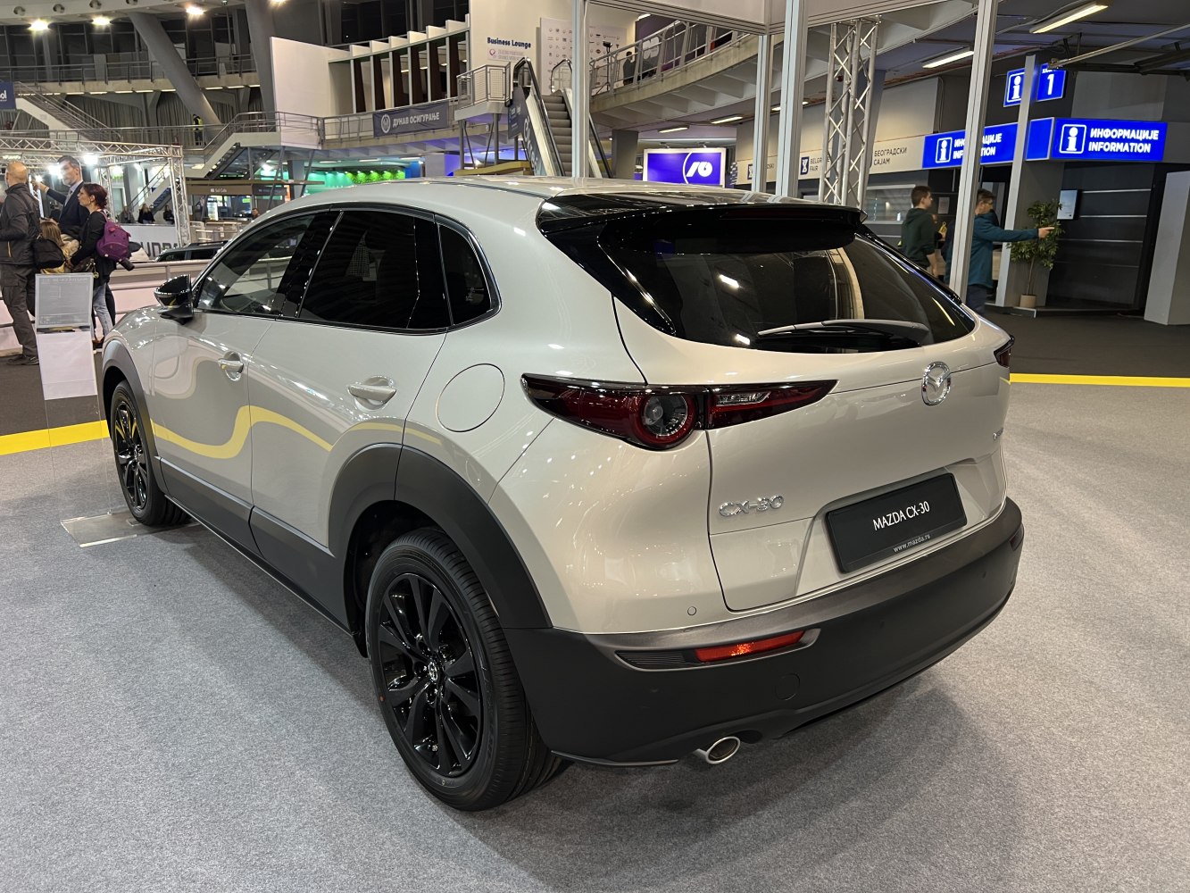 Rear-side view of compact SUV with black alloy wheels and sleek taillights