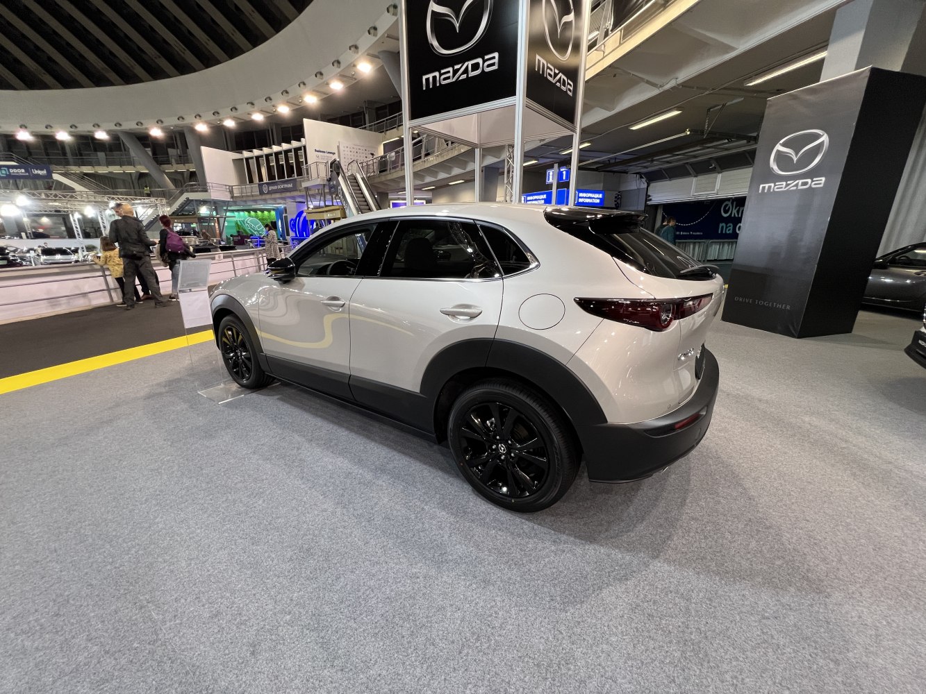Side and rear view of a modern SUV with black alloy wheels
