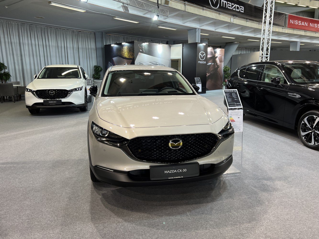 Front view of a Mazda CX-30 with prominent grille and headlights