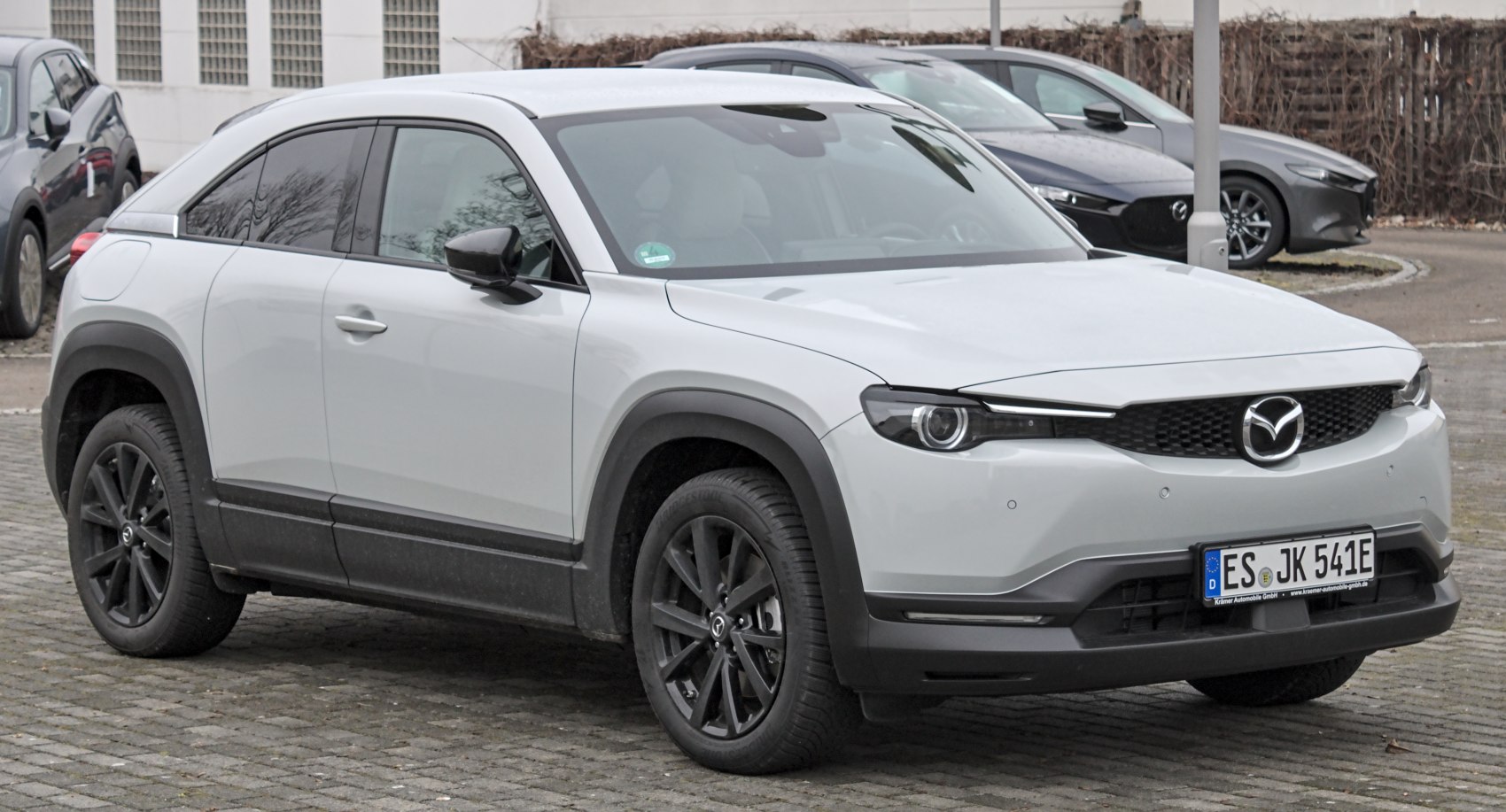 Front three-quarter view with LED headlights and black alloy wheels