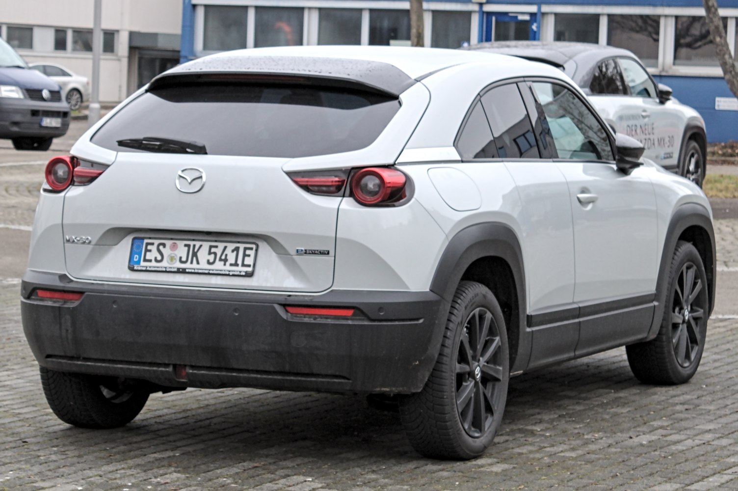 Rear view showcasing round taillights and modern compact SUV design