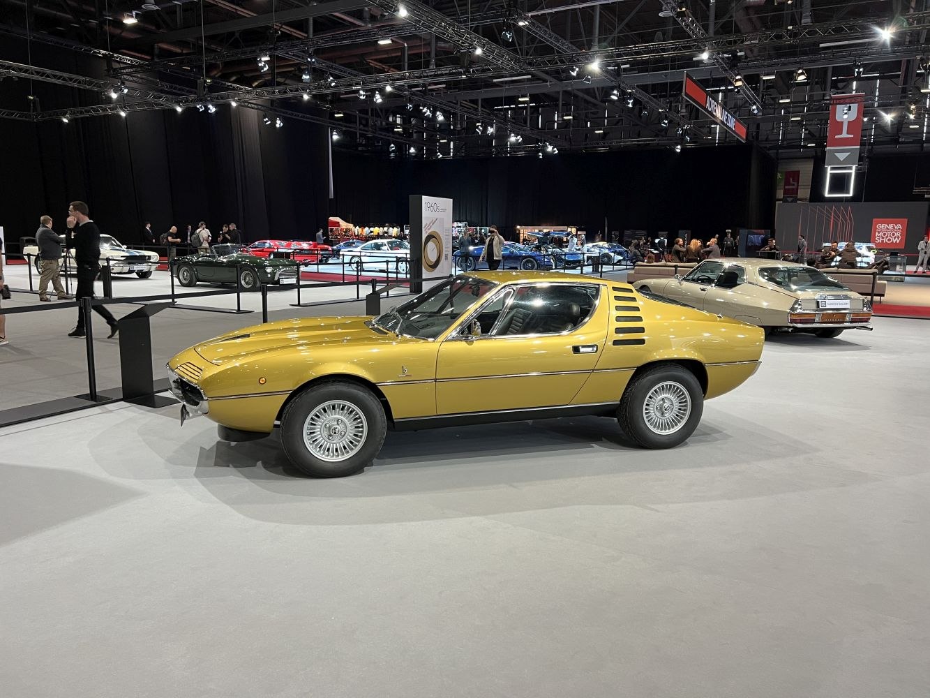Vintage sleek sports coupe with distinctive rear side vents and classic alloy wheels.