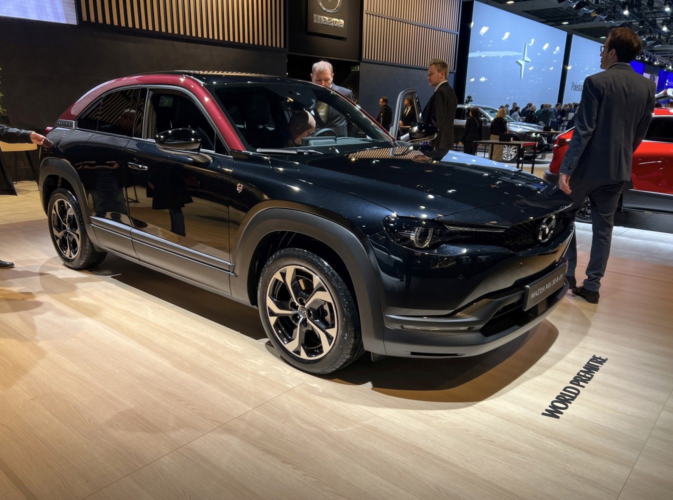 Two-tone roof SUV with dynamic alloy wheels and sleek black body.