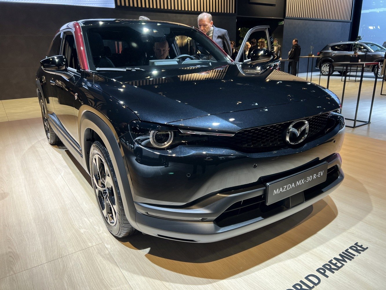Front view of black electric SUV with LED headlights and aerodynamic design