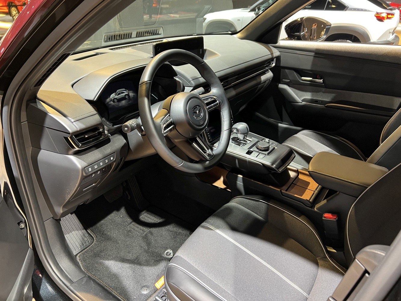 Modern car interior featuring dashboard, steering wheel, and center console