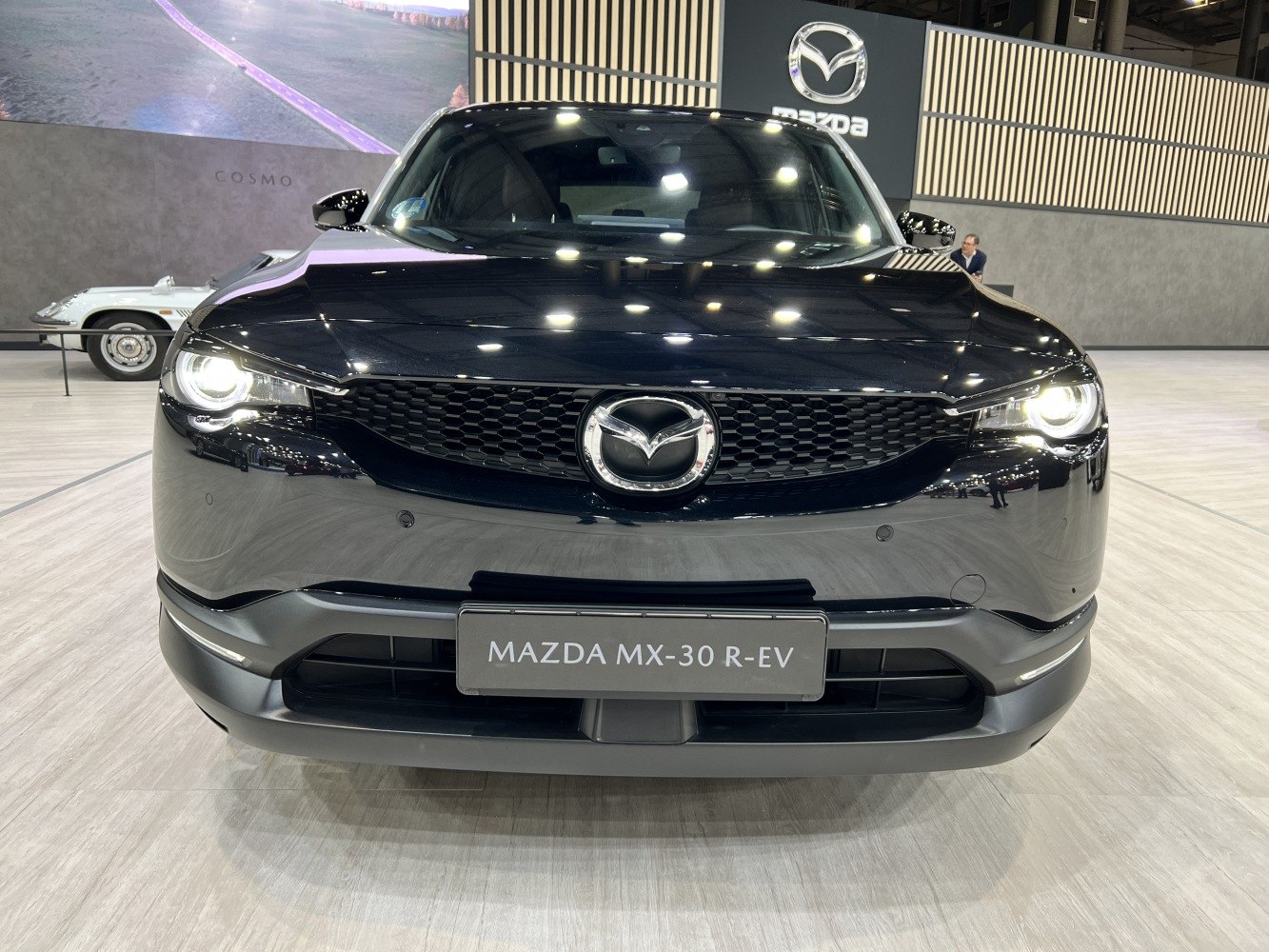 Front view featuring signature grille and LED headlights