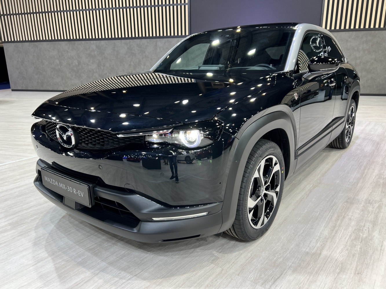 Front angle of black electric SUV with LED headlights and alloy wheels