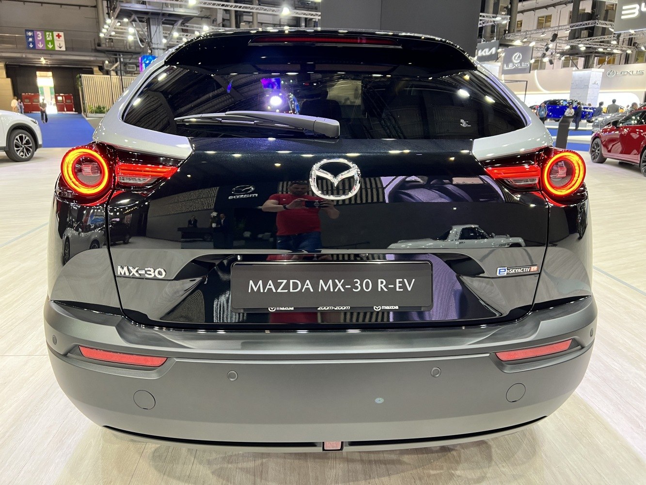 Rear view with circular tail lights and Mazda badge