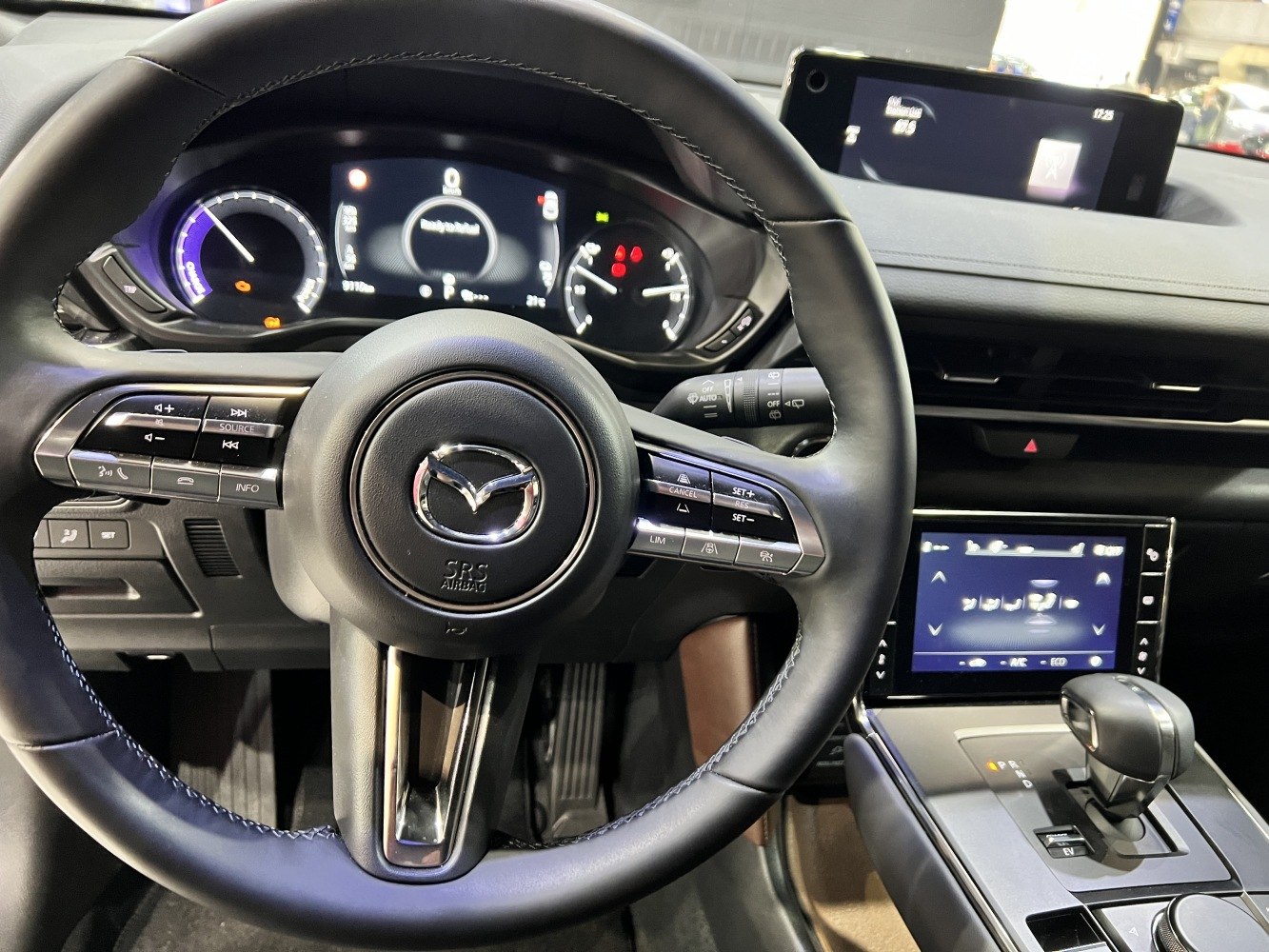 Multifunction steering wheel with digital instrument cluster and infotainment display