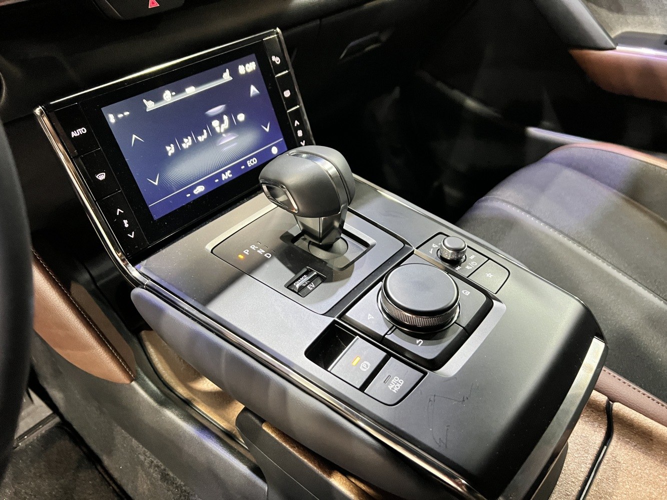 Center console with gear selector and infotainment controls