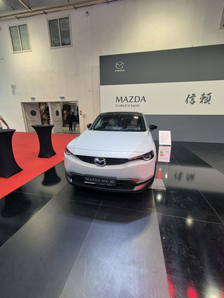 Front view of a modern electric SUV with distinctive grille and sleek headlights