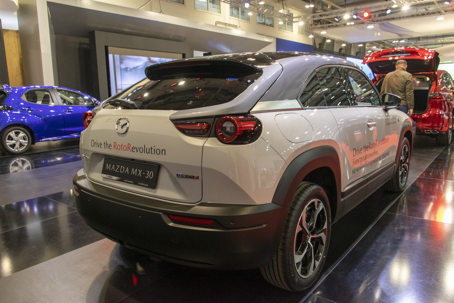 Rear and side view of an electric SUV with distinctive taillights and alloy wheels