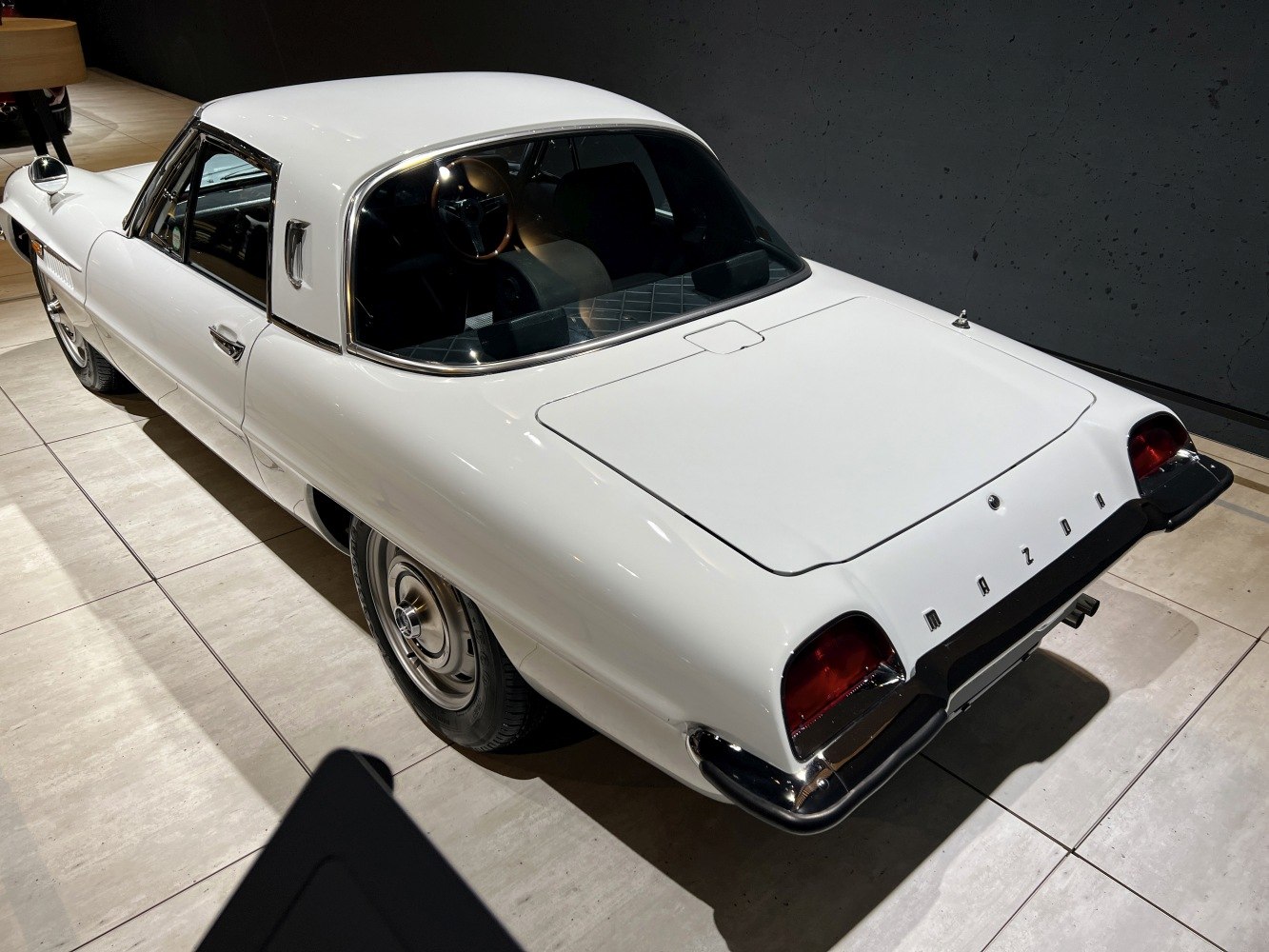 Rear hatchback and curved roof with vintage wheels