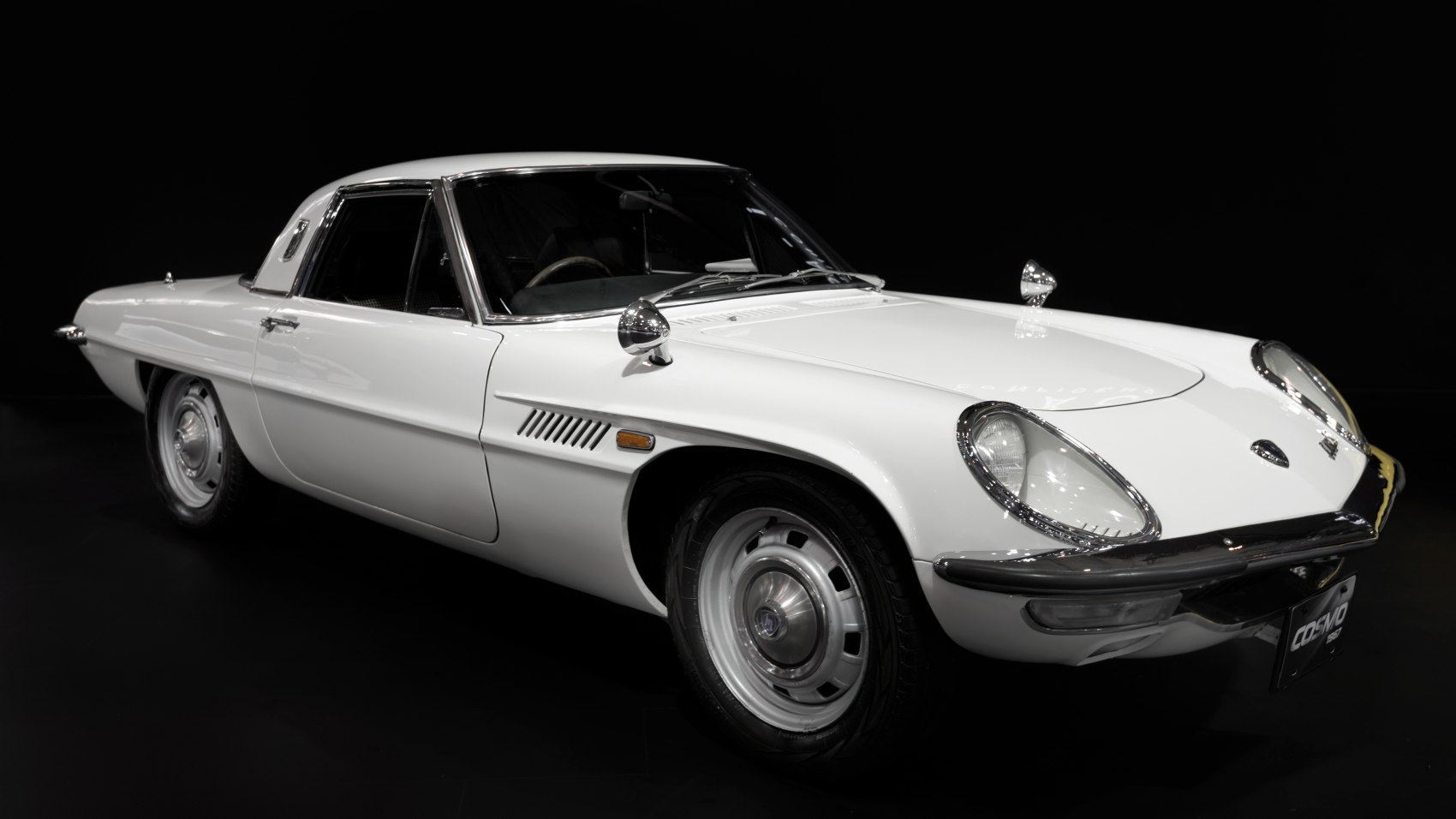 Classic coupe with round headlights and chrome details