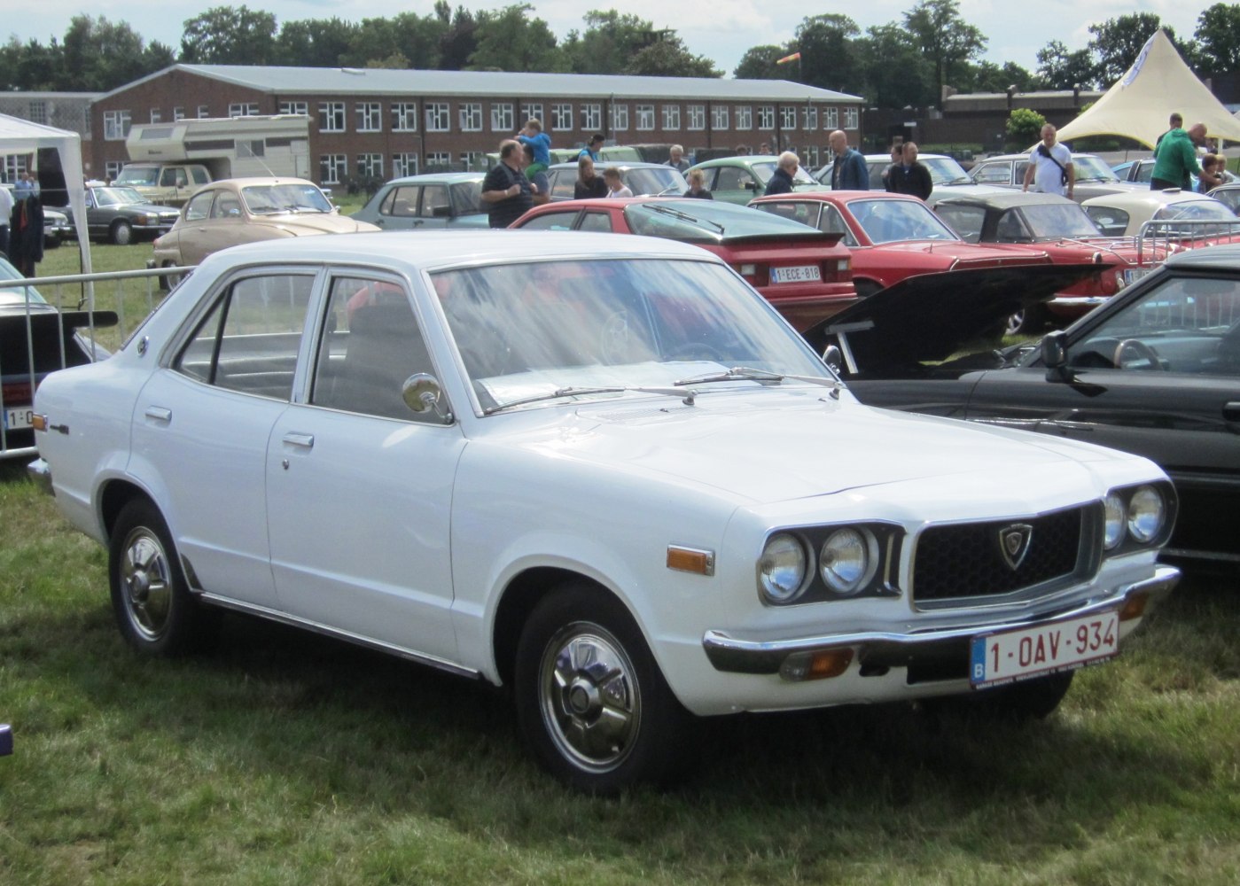 Vintage white sedan with chrome bumpers and round headlights