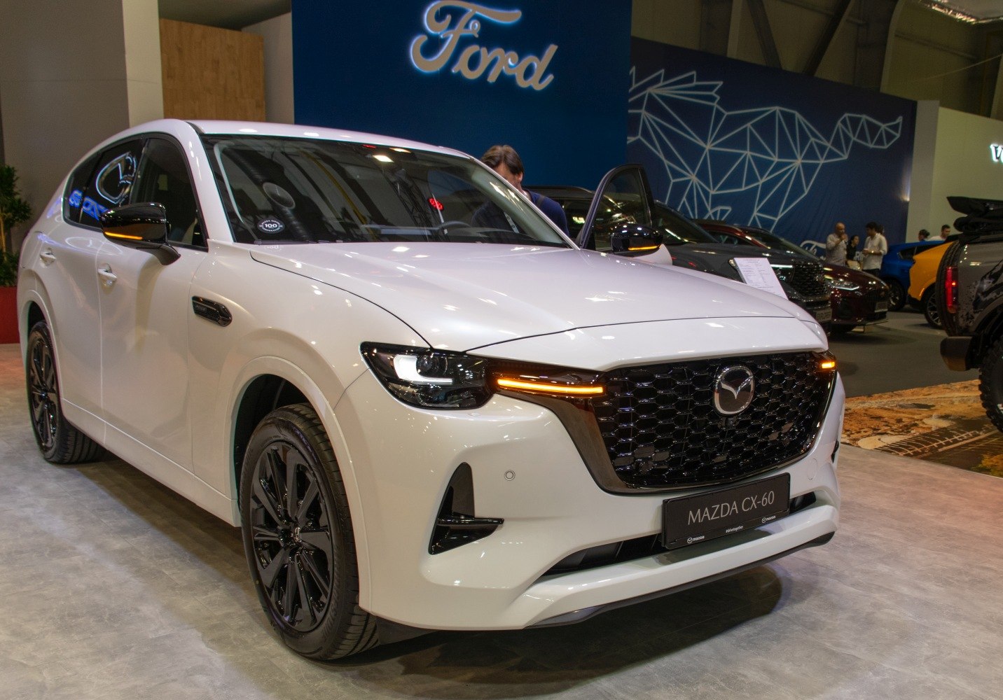Front view of SUV featuring distinctive grille and LED daytime running lights