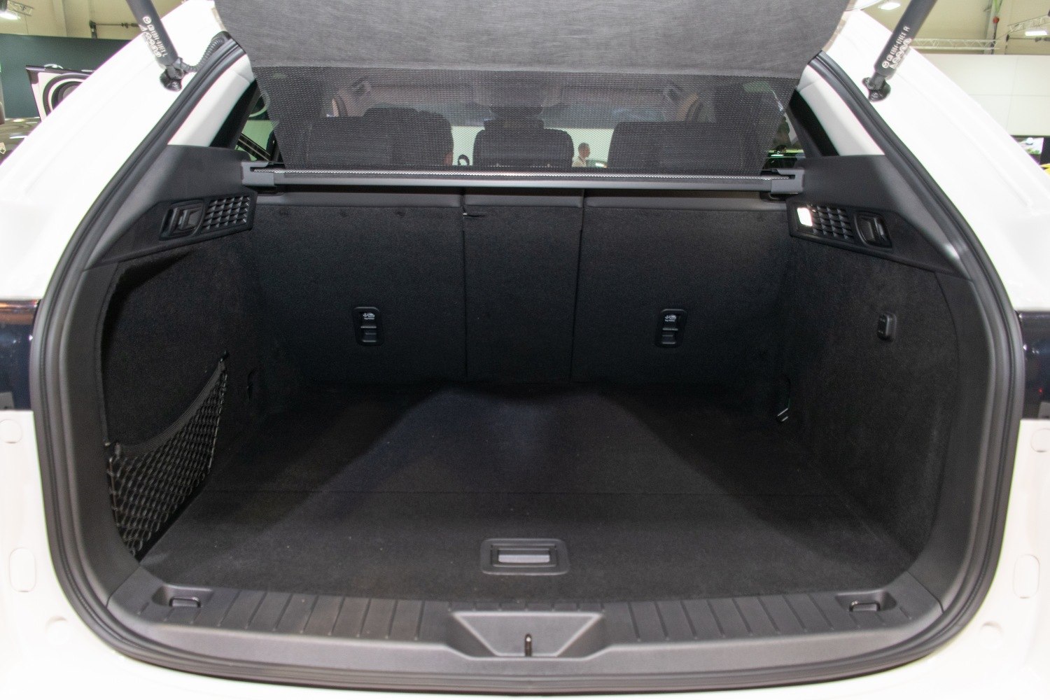 Spacious trunk and cargo area with cargo net and retractable cover