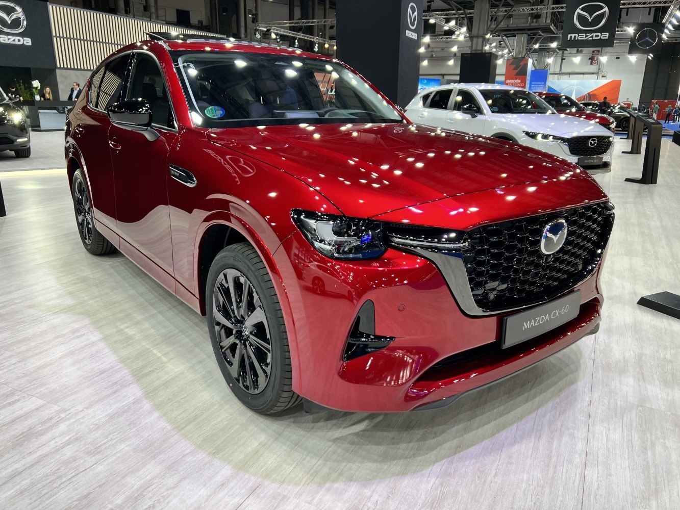 Front view of red SUV with black grille and headlight design