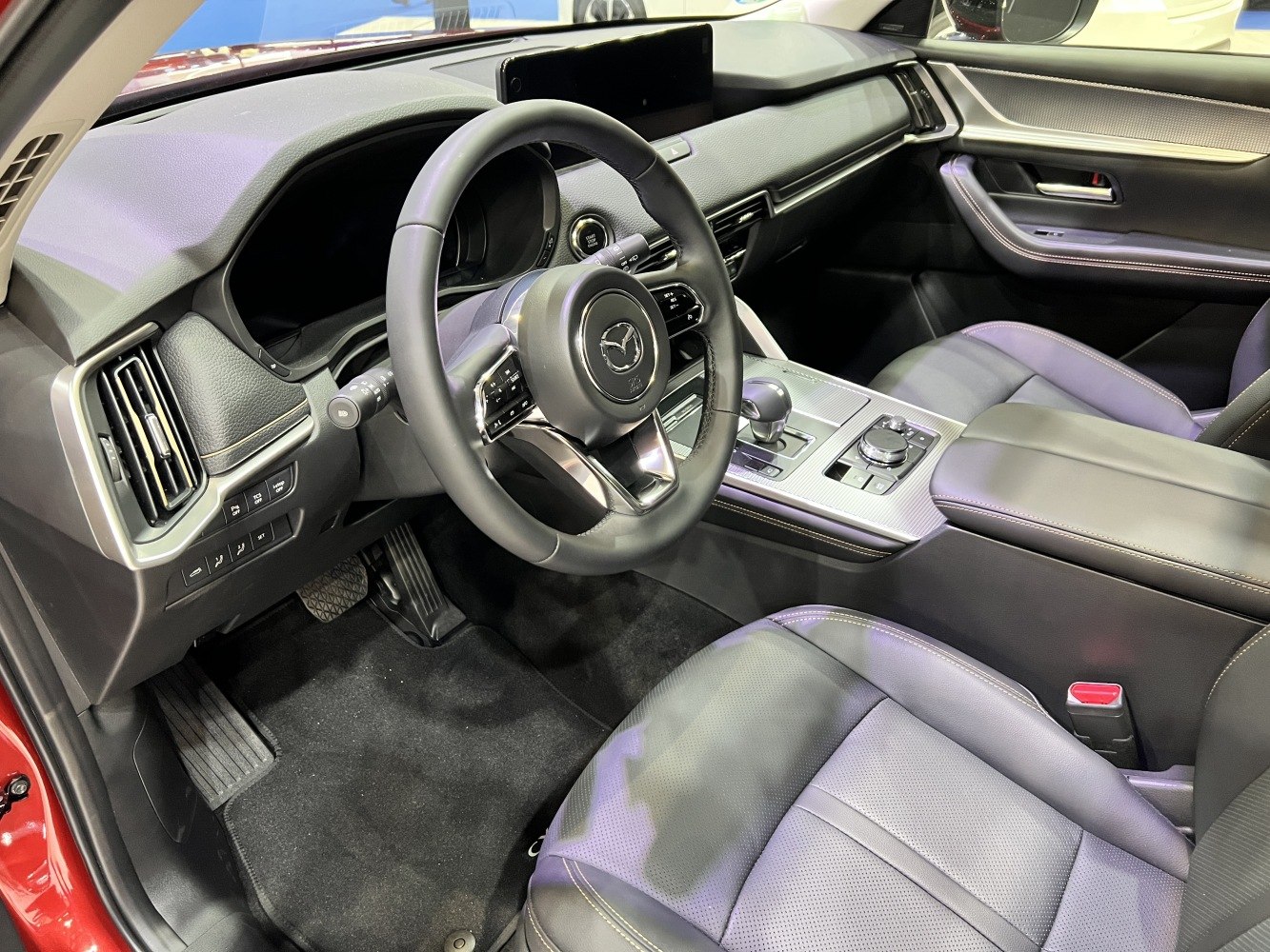 Steering wheel, dashboard, and center console with controls
