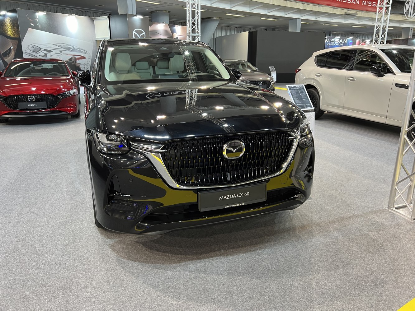 Sleek black SUV front view featuring large grille and LED headlights
