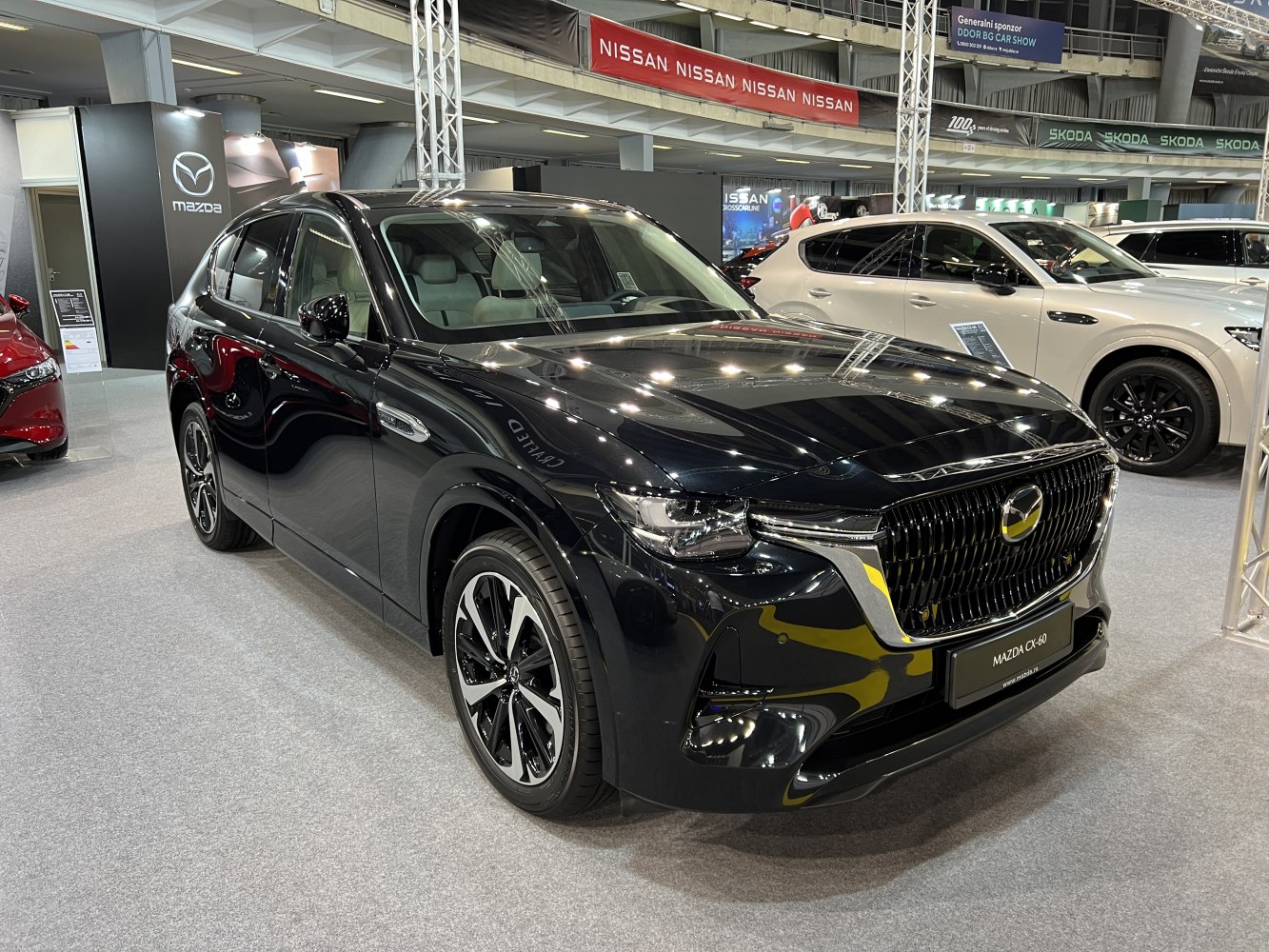 Glossy black SUV with modern grille and alloy wheels