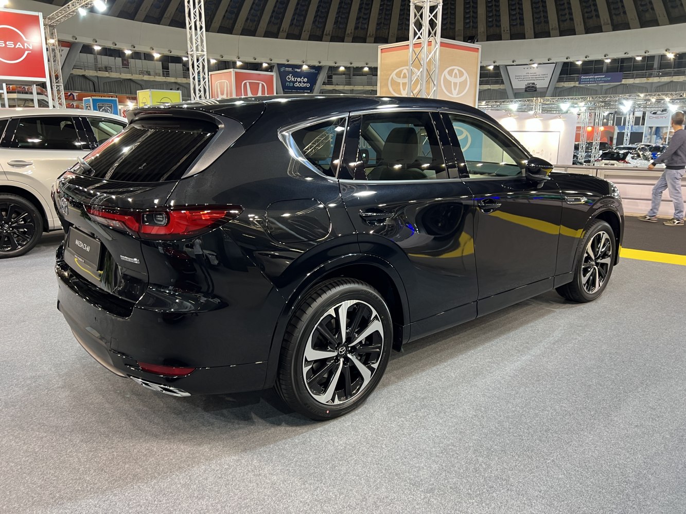 Rear-side profile of sleek SUV with modern taillights and alloy wheels