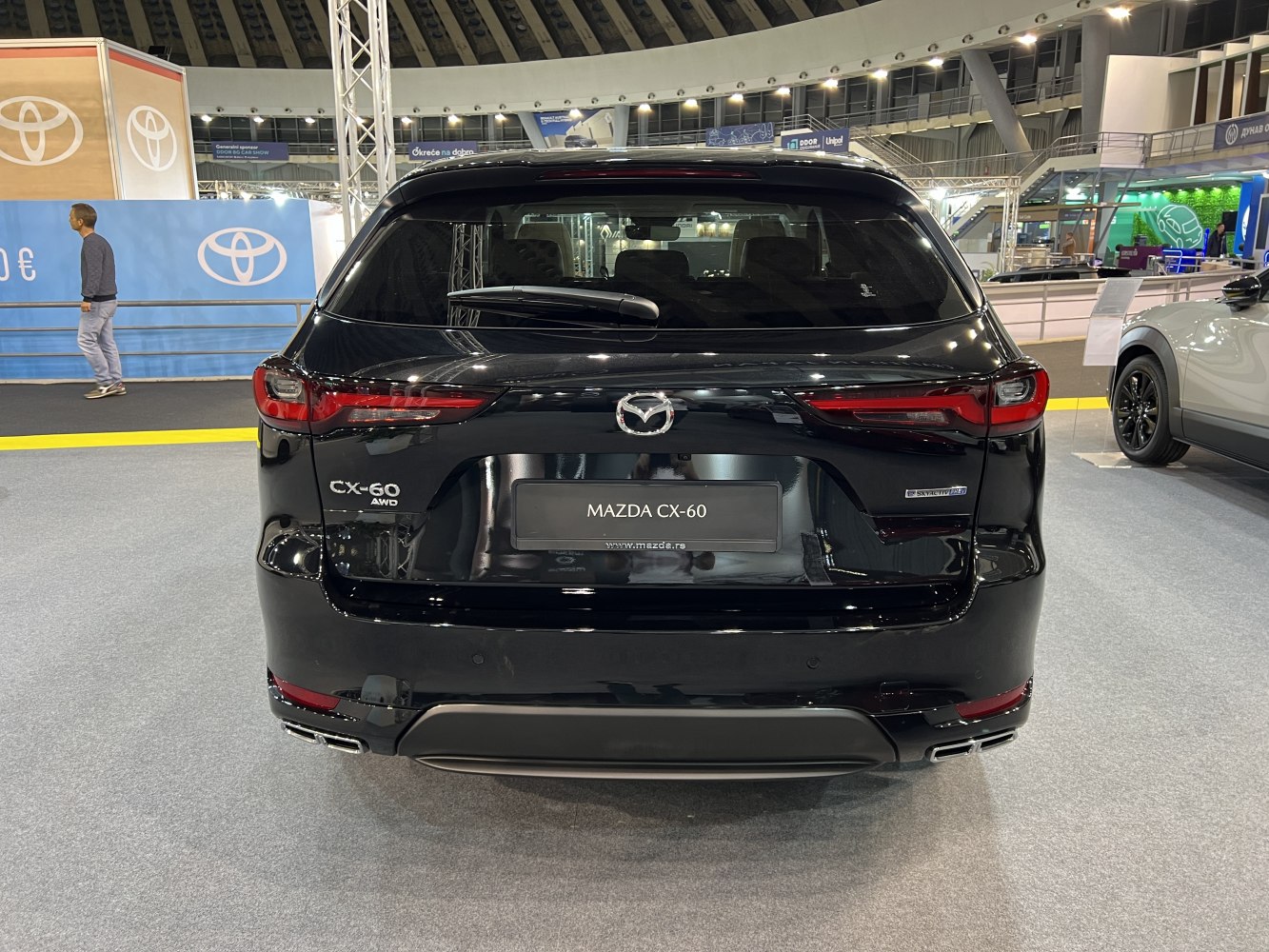 Rear view of AWD SUV with modern taillights and dual exhausts
