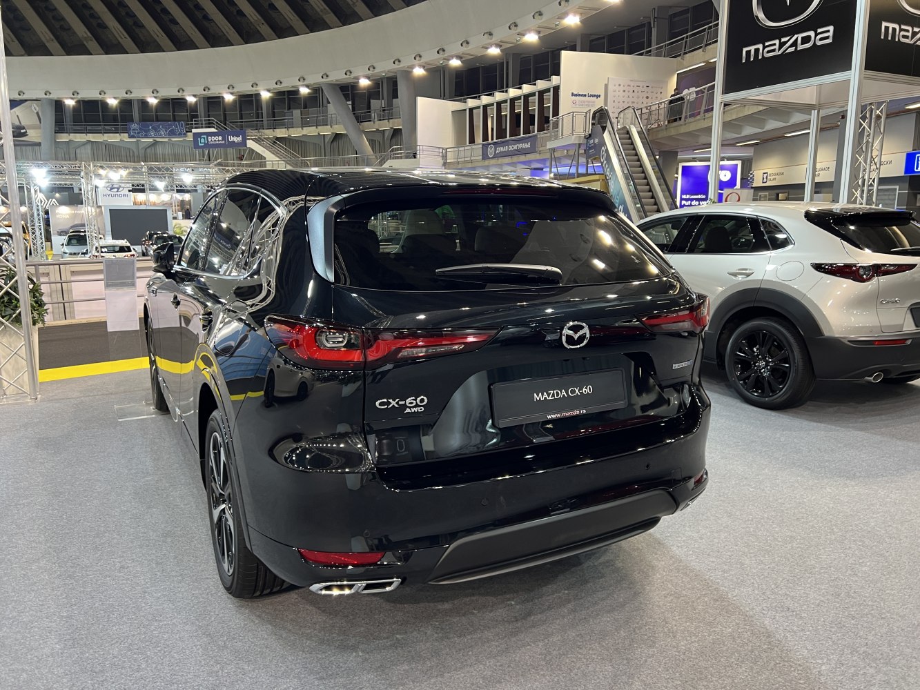 Rear view of an AWD SUV with sleek taillights and dual exhaust