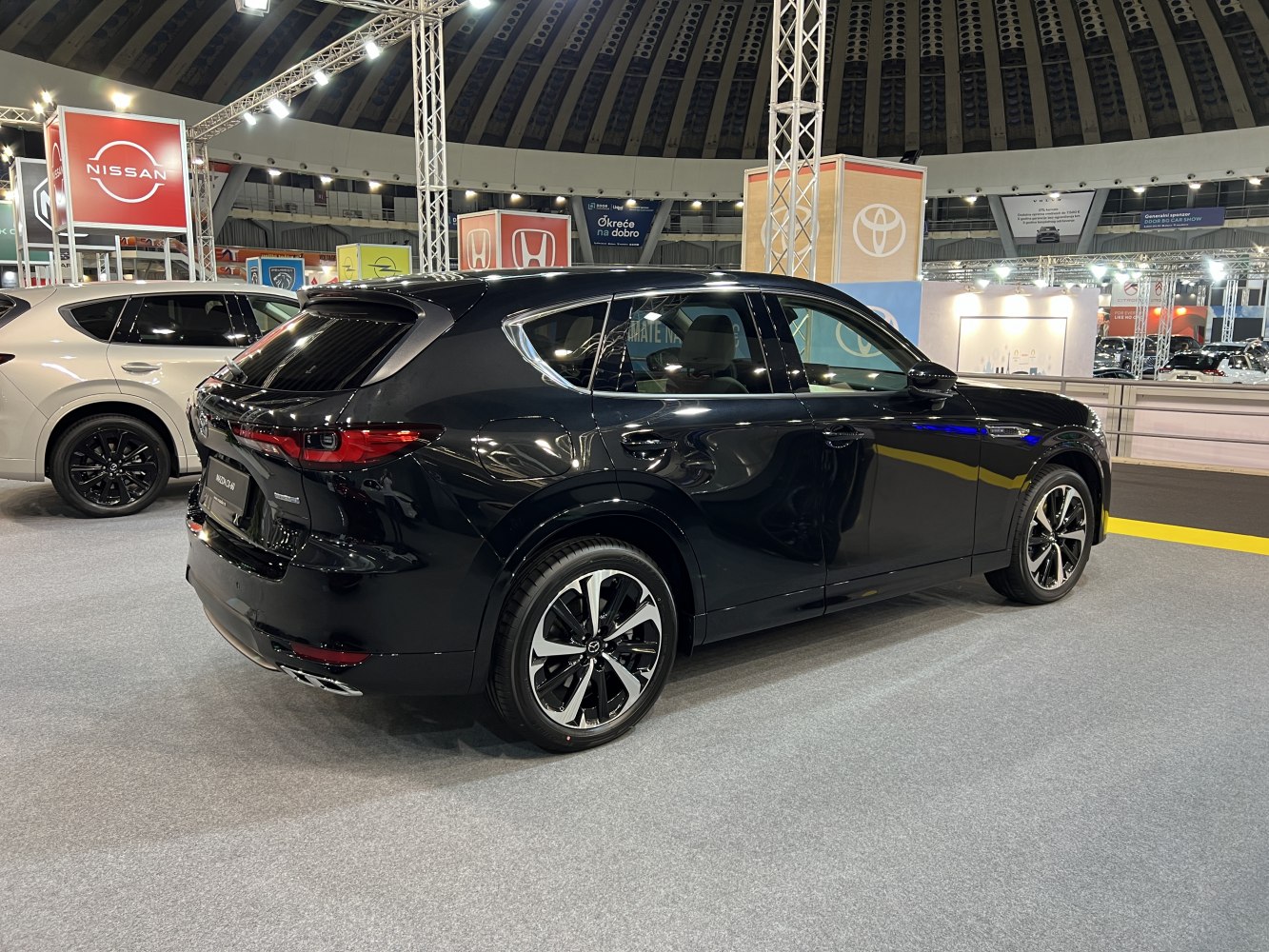 Black SUV rear side profile with taillights and alloy wheels