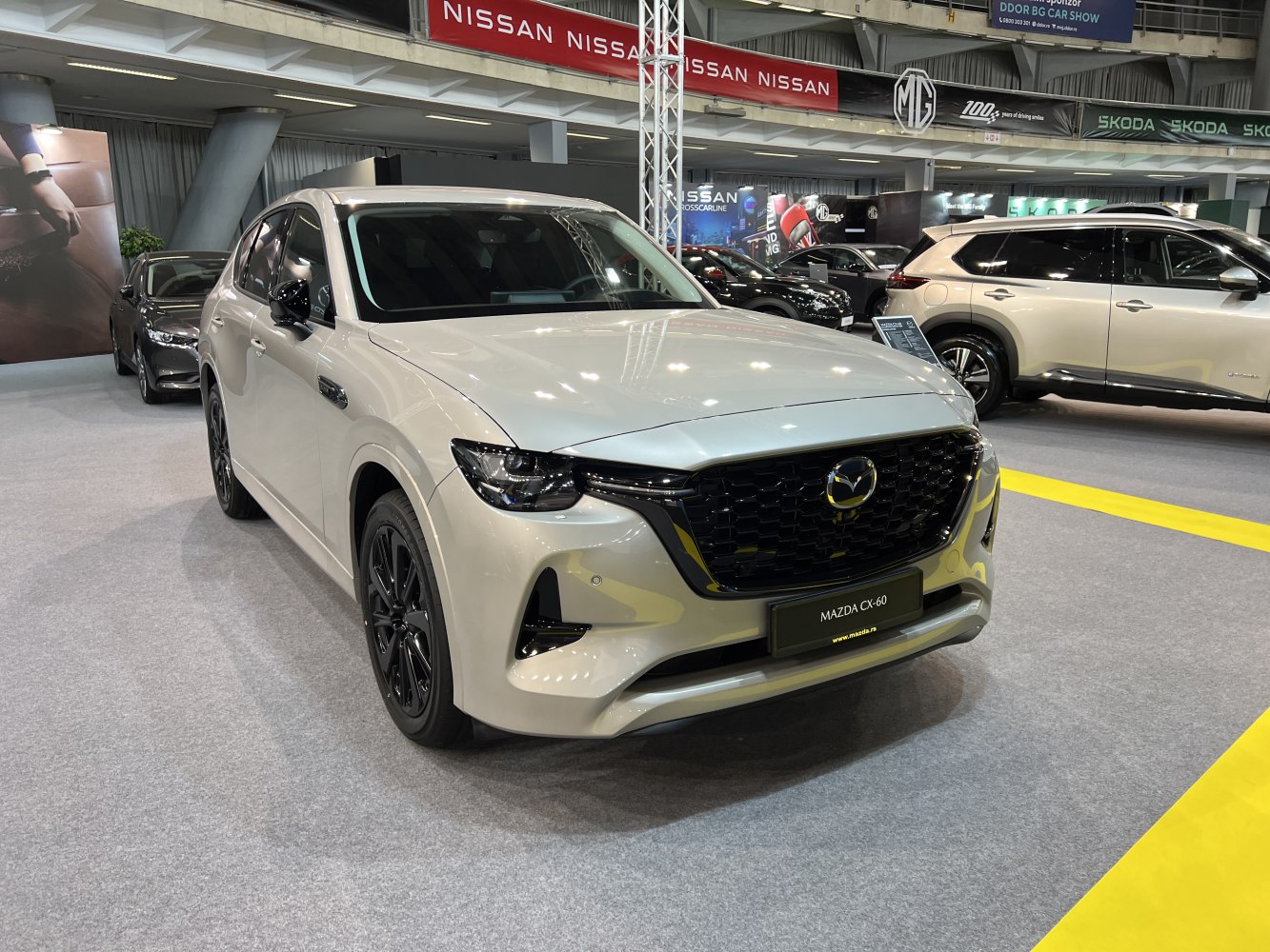 Front view with black grille and sleek headlights