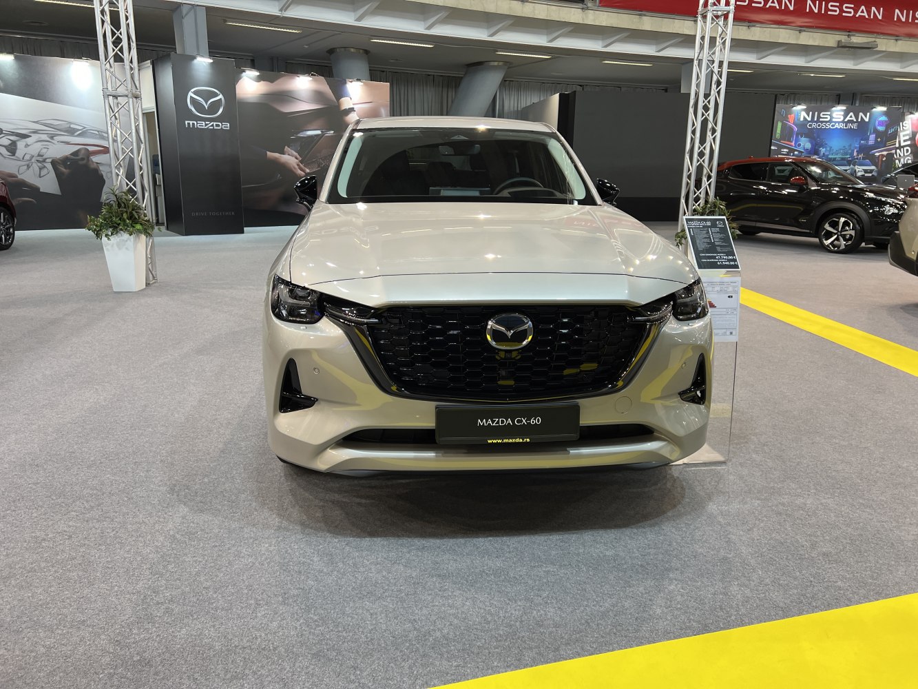 Front view with large black grille and sleek LED headlights
