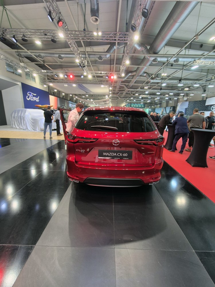 Rear view of red SUV with modern taillights and sporty rear design
