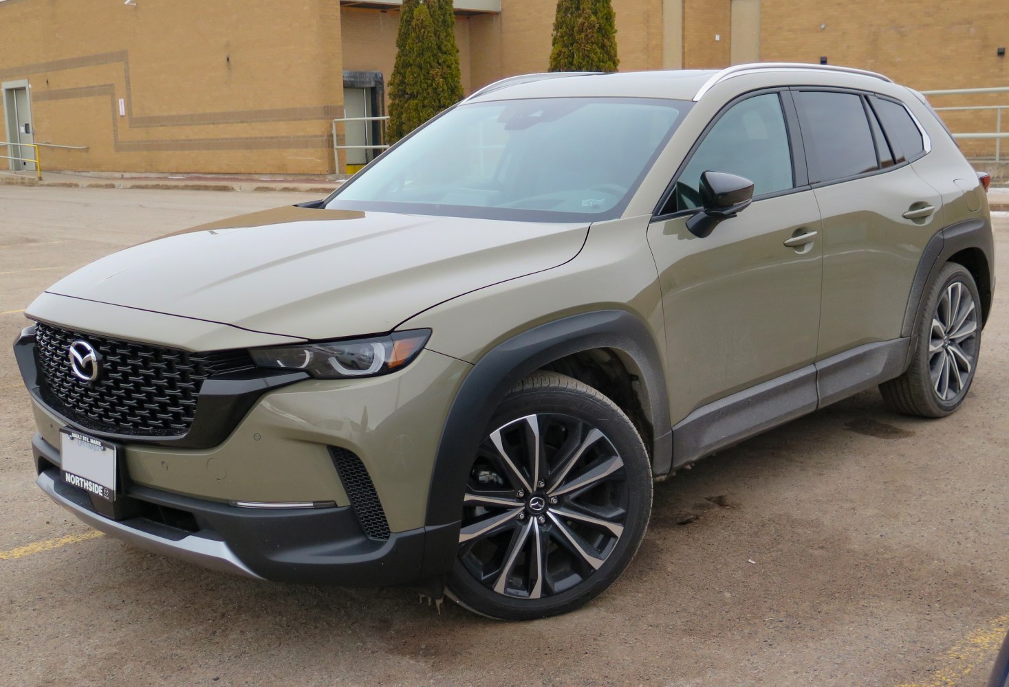Bold front grille and large alloy wheels on modern SUV design