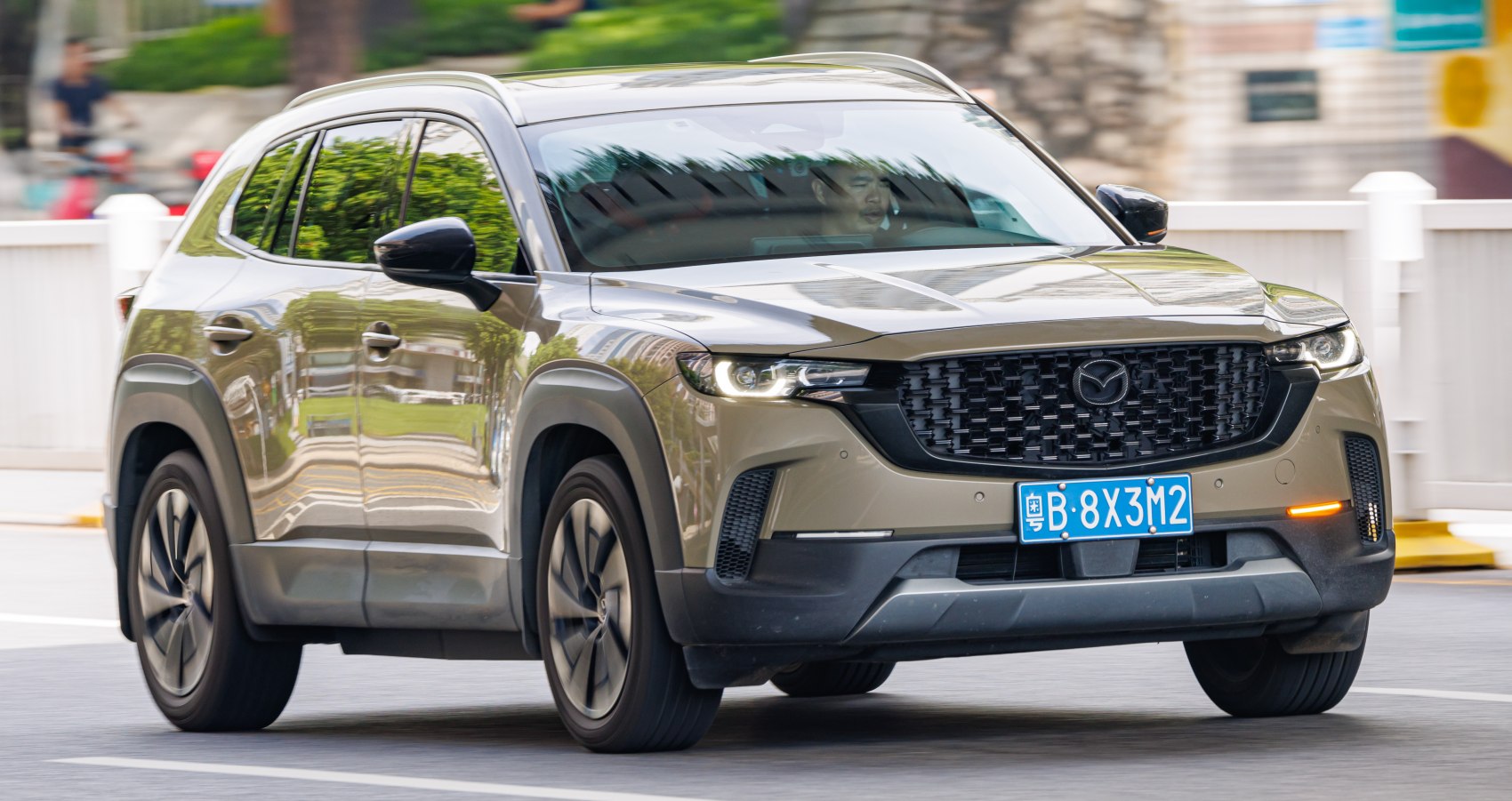 Front view of SUV with LED headlights and black mesh grille